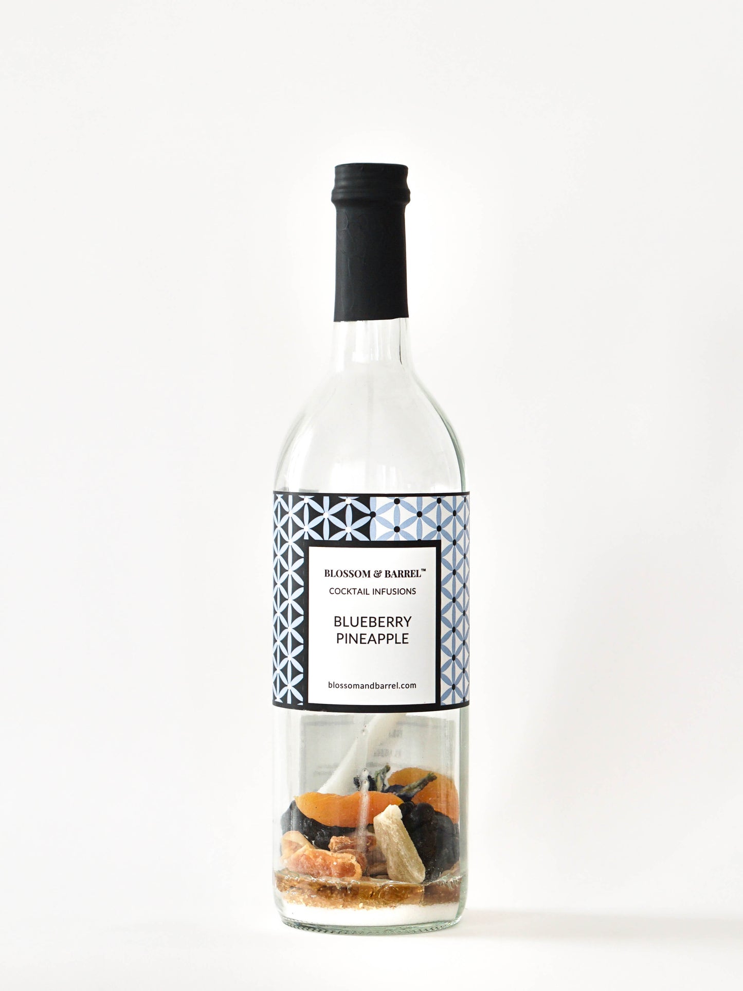 Bottle of blueberry pineapple cocktail mix on a white background