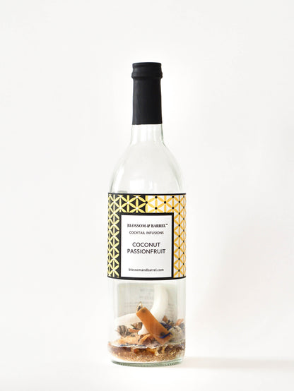 Bottle of coconut passionfruit cocktail infusion with a decorative label on a white background