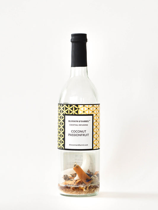 Bottle of coconut passionfruit cocktail infusion with a decorative label on a white background