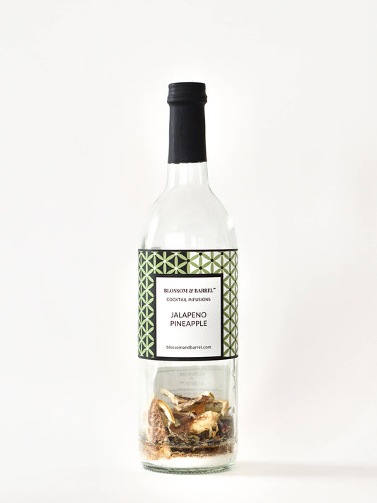 Bottle of Jalapeno Pineapple cocktail mix with decorative label on a white background
