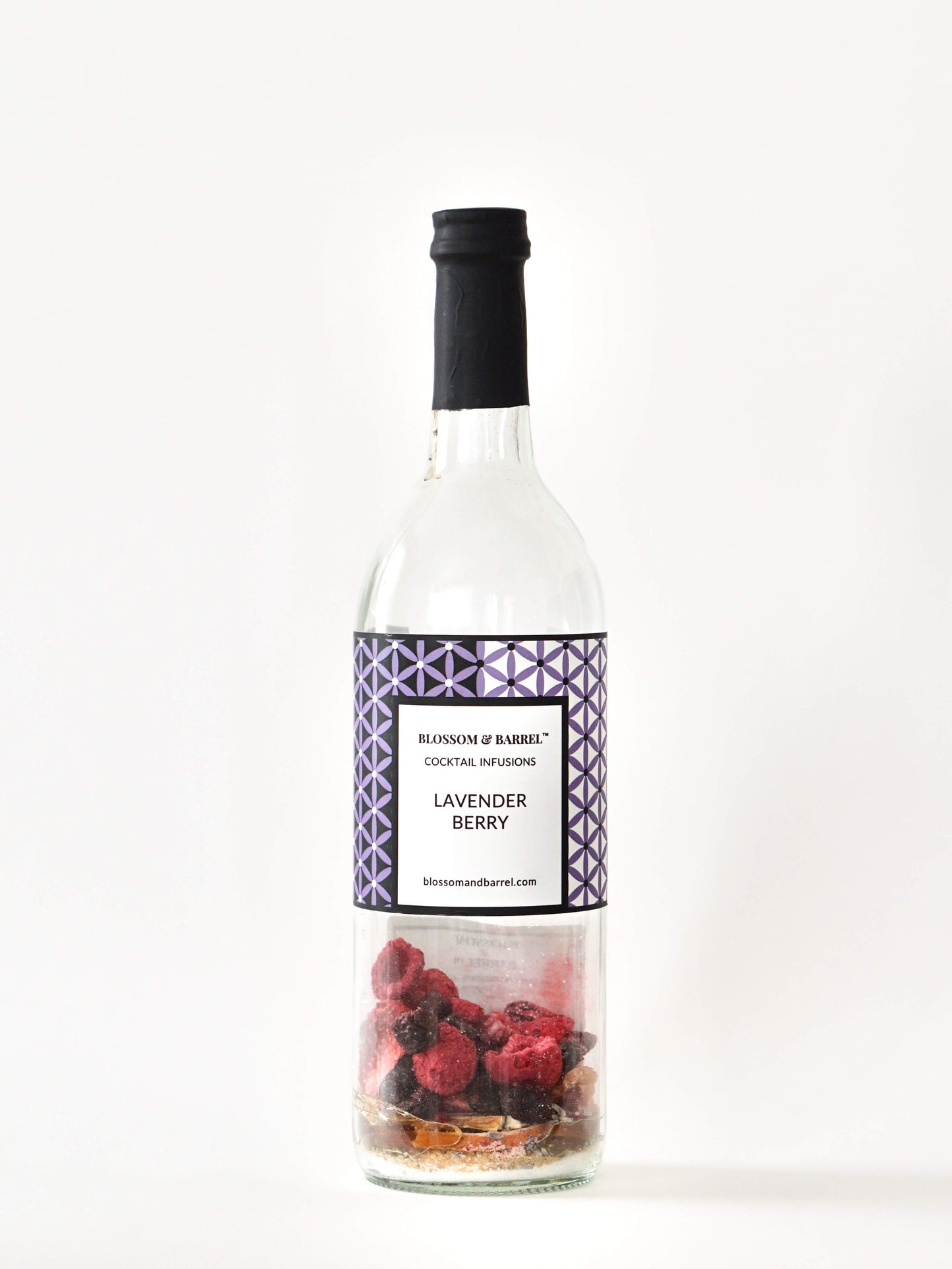 Bottle of Lavender Berry cocktail infusion with a label on a white background