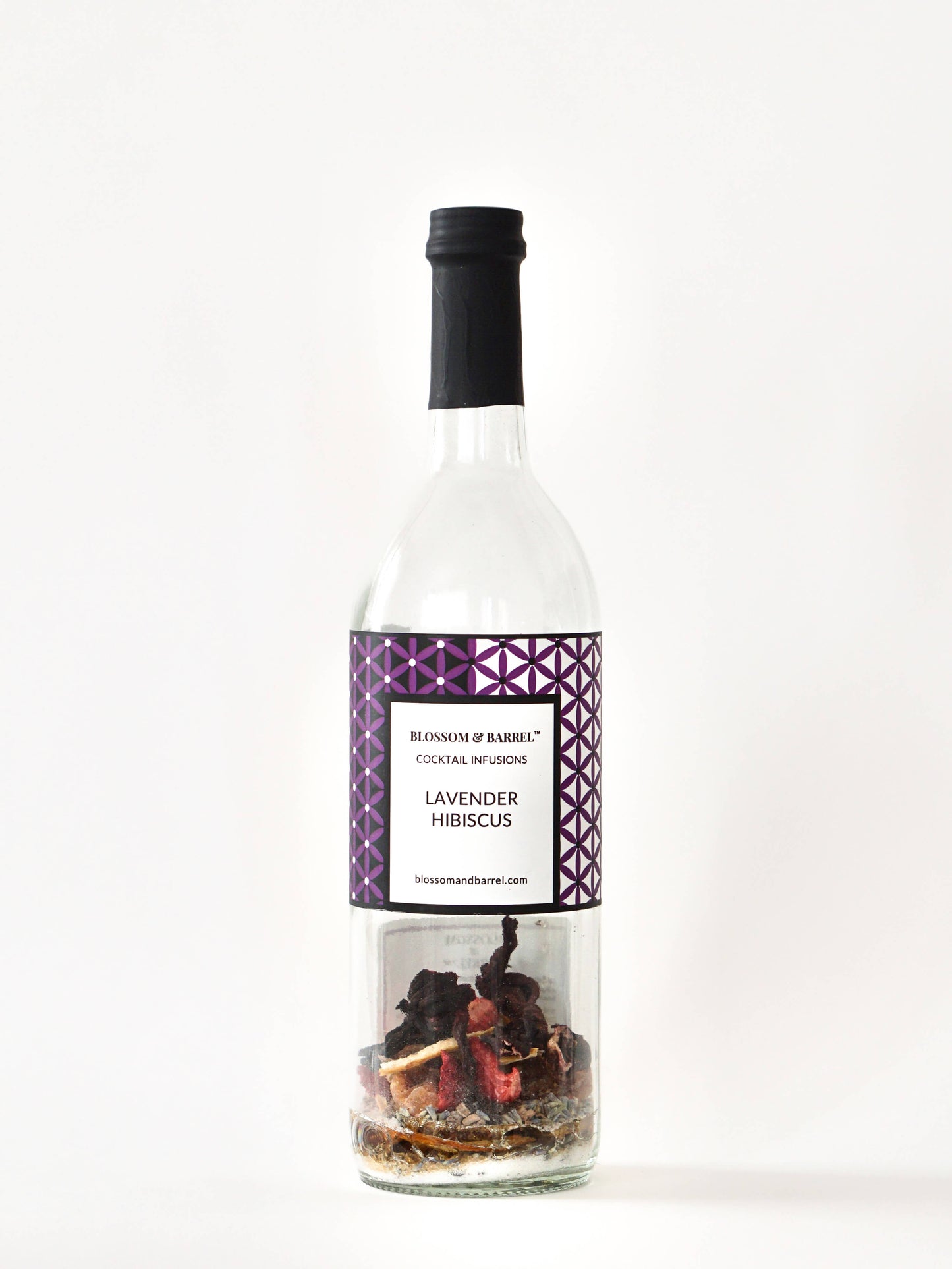 Bottle of Lavender Hibiscus cocktail mix with a decorative label on a white background