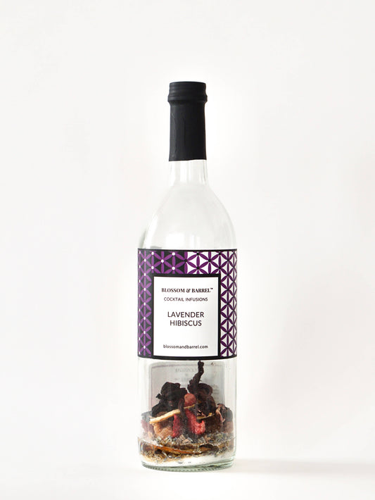 Bottle of Lavender Hibiscus cocktail mix with a decorative label on a white background