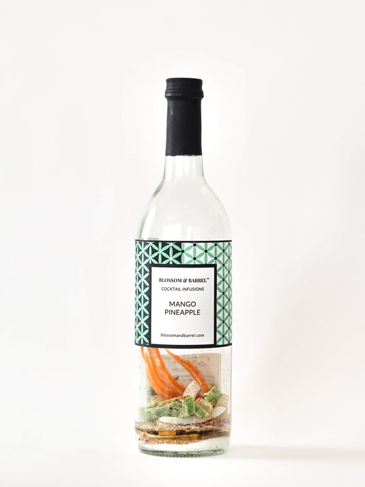 Bottle of mango pineapple cocktail mix with a label on a white background