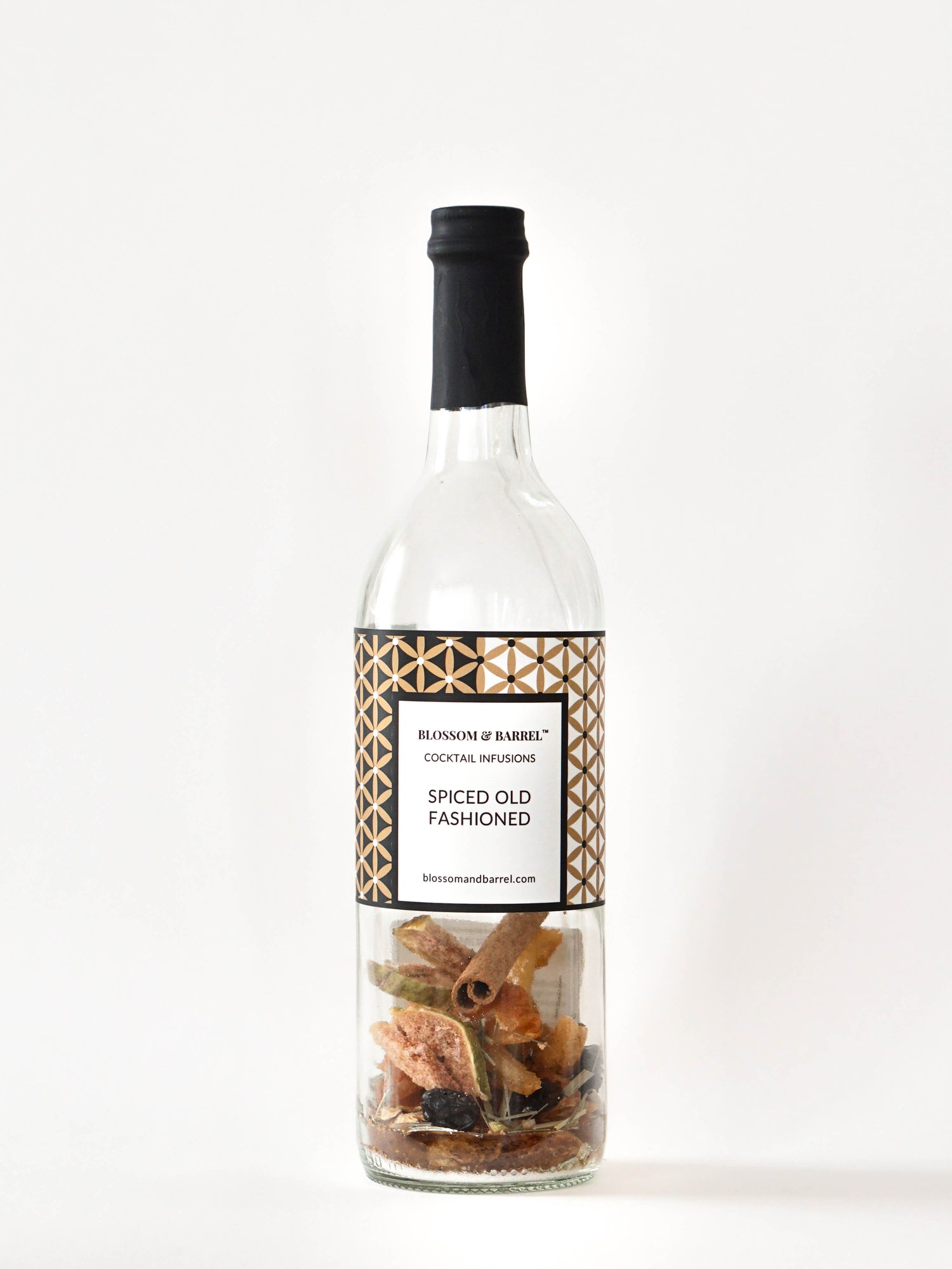 Bottle of 'Spiced Old Fashioned' cocktail infusion with a label on a white background