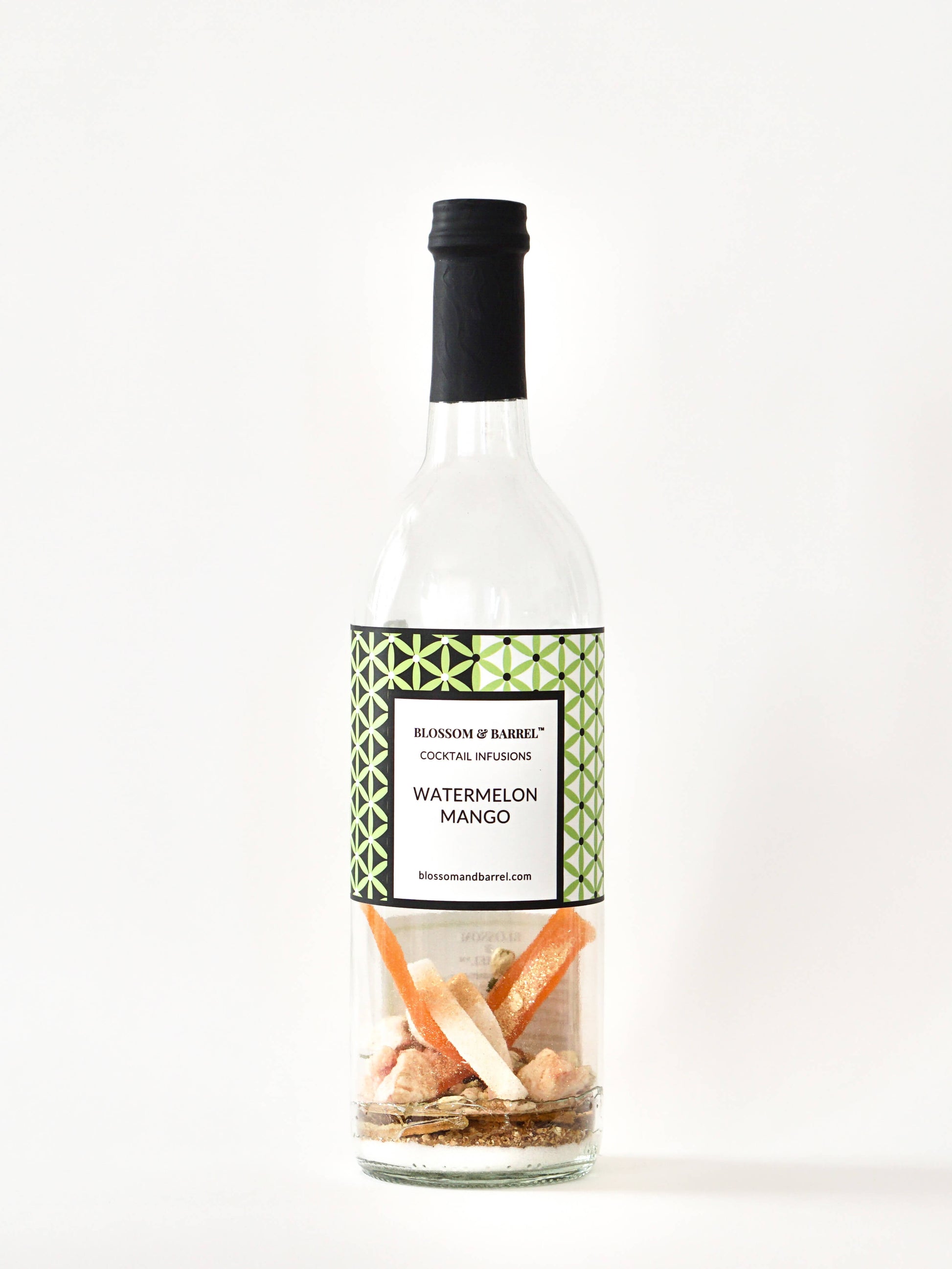 Bottle of watermelon mango cocktail infusion with a label on a white background